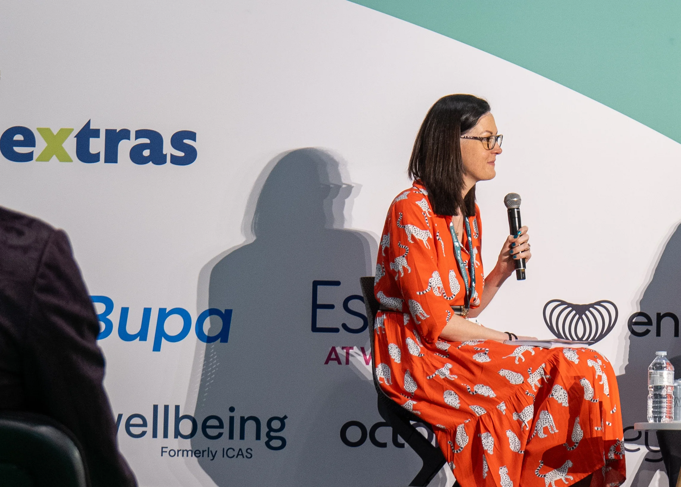 Clare E Kenny speaking on a workplace wellbeing panel