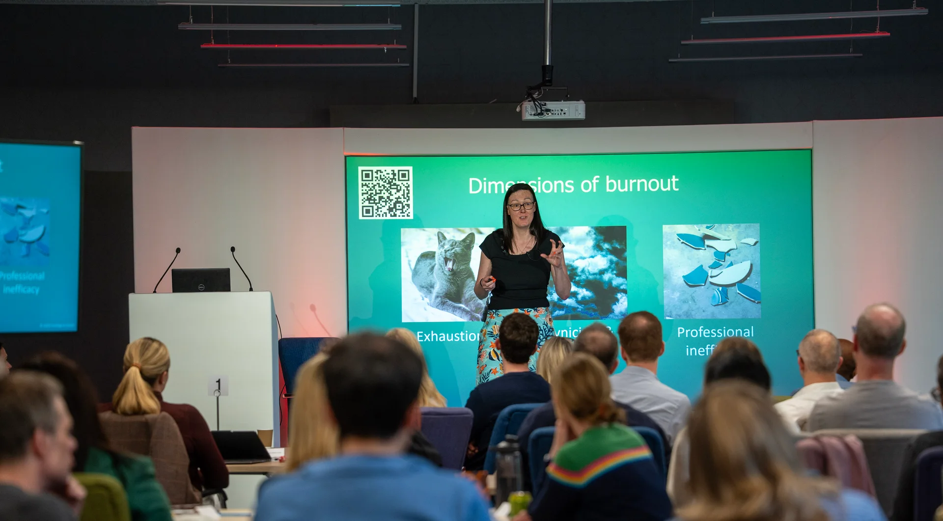 Clare E Kenny presenting on burnout to an audience