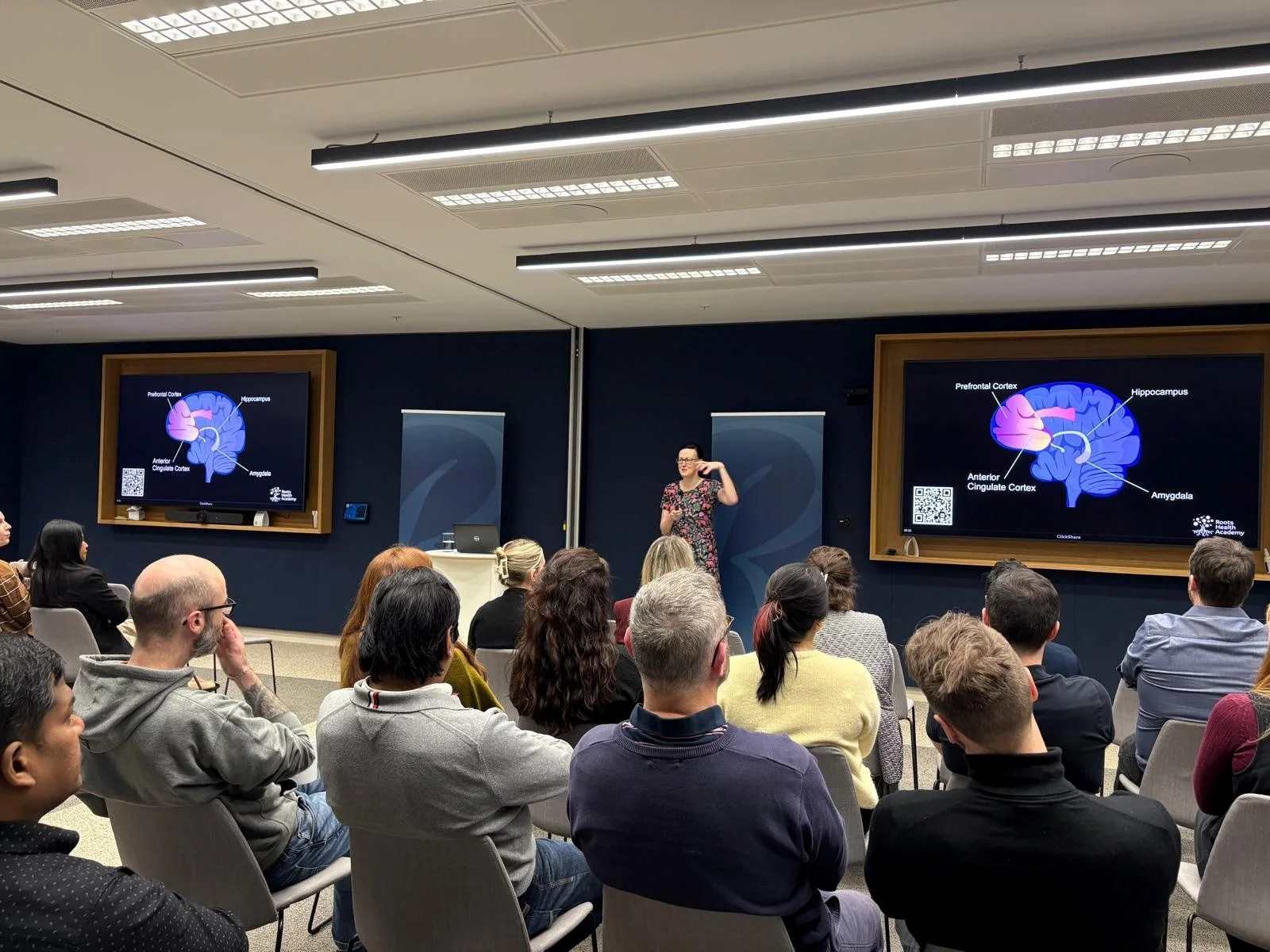 Clare E Kenny speaking about neuroscience to an audience